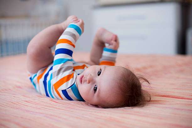 The baby play in the bed